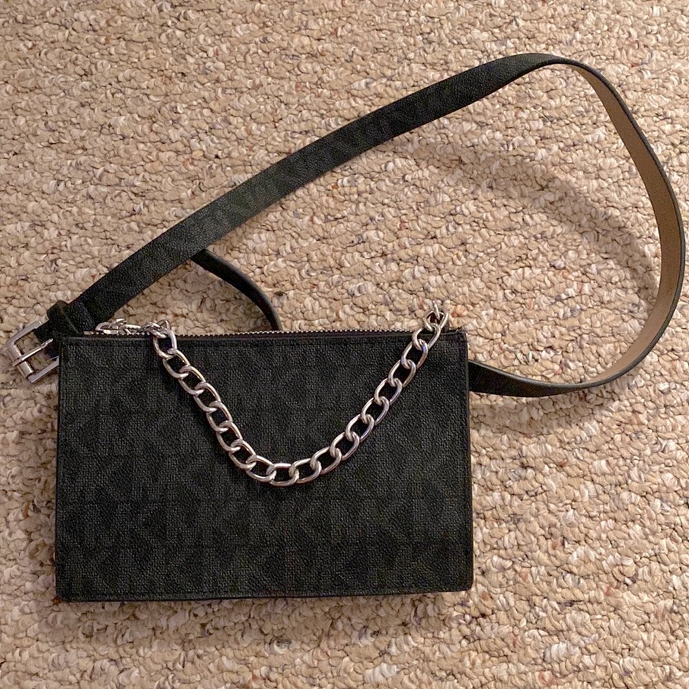Michael Kors. Brand New!! Tag on. Never used; tissue still inside the clutch!!